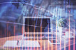 © peshkova - Forex market graph hologram and personal computer on background. Double exposure. Concept of investment.