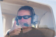 © Tana Teel Photography/Stocksy - A male passenger giving thumbs up for take off in small plane