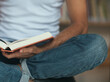 © Mosuno/Stocksy - Close Up of a Man Holding a Book