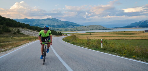 Poster - triathlon athlete riding bike