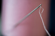 © JEFF WASSERMAN/Stocksy - Needle and Thread in Spool of Thread