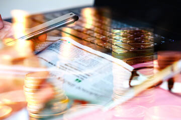 Double exposure, business working a smartphone and coins stacked background and advertising coins of finance and banking, increasing columns of gold coins on table