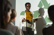 © Seventyfour - Portrait of young African-American woman giving speech on recycling and waste management during eco conference