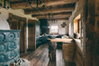© Akela - from alp to alp/Stocksy - luxury open kitchen and livingroom inside a rustic austrian wooden alpine cabin