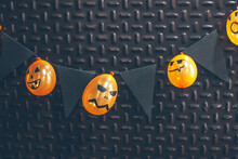 Funny Homemade Halloween Decoration With Orange Balloons.
