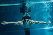 © Ibex.media/Stocksy - man swimming underwater