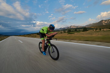 Wall Mural - triathlon athlete riding bike