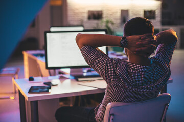 Programmer Working at His Office at Night