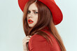 Beautiful woman in hat red lips jacket charm lifestyle studio light background