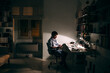 © Lumina/Stocksy - Caucasian Man Texting at His Desk at Night