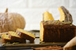 © Tavan - Gluten Free Pumpkin bread loaf set white cafe table.