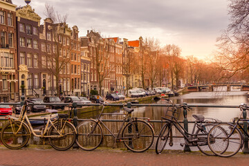 Wall Mural - Amsterdam canal and bikes during a sunset