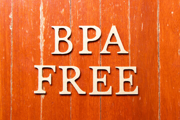 Wall Mural - Alphabet letter in word BPA (abbreviation of Bisphenol A) free on old red color wood plate background