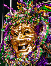 Mardi Gras Mask Hanging On Balcony's Railing