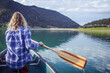 © Kelly/Tetra Images - Woman canoeing in lake