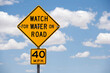 © Tetra Images - Road sign against cloudy sky
