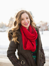 Portrait Of Woman Wearing Red Scarf Smiling Outdoors