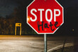 © Kristen Curette Photography LLC/Stocksy - Someone spray painted on a sign, that now says 'Stop Hate'