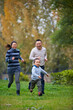 © Bo Bo/Stocksy - happy asian family in the park