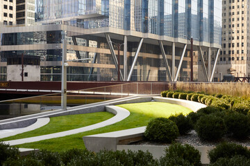 Green and glass environmentally friendly urban architecture for sustainability in city center downtown.