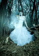 © Bratislav Nadezdic/Stocksy - Fairy in white dress in blue forest