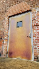 Patina door. Back alley.