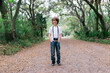 © Cara Dolan/Stocksy - Boy with camera takes a walk outside