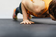 © minamoto images/Stocksy - Woman Doinf Pushups In Gym