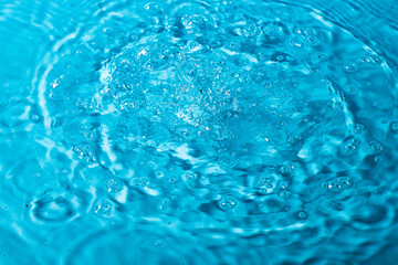 splash of water on a blue background. Abstract wallpaper