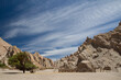 © Gonzalo - Rural scenic. View of the ranch rustic pen and fence in the arid desert. The sandstone and rocky hills in the background.