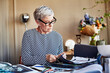 © ALTO IMAGES/Stocksy - Senior Design Professional Working On Project