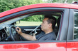 © Preappy/Stocksy - Man with a mobility impairment driving a car equipped with hand controls
