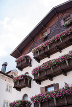 A Typical, Nice Motel In The Alps With Balconies And Flowers
