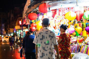 Wall Mural - People come to the street of lanterns to shopping and take photos for the mid-autumn festival in Cho Lon, Chinatown, Vietnam