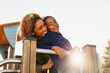 © BONNINSTUDIO/Stocksy - Portrait of a mother and her son having fun at the playground.