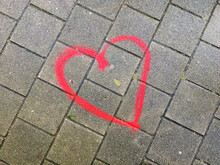 Red Heart Painted On The Street Of Pavement