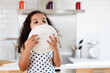 © Lisa Tichané - Cute little girl licks last remaining drops from plate
