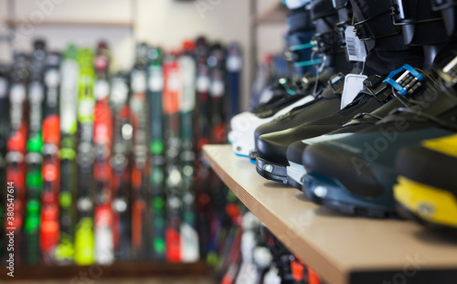 Fotomural Sport equipment shop interior with large assortment of modern ski boots