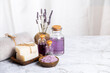 Natural soap with lavender aroma therapy and salt scrub for body and mind relaxation on white marble table with white background and copy space.
