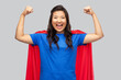 © Syda Productions - women's power and people concept - happy asian woman in red superhero cape over grey background