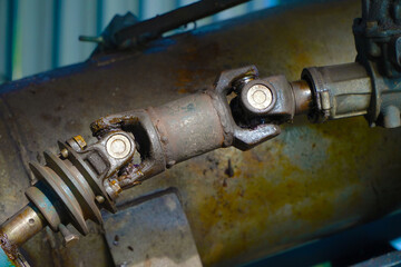 Metal steel drive shaft, torque support and universal joint with dirty grease.
