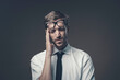 Stressed businessman with headache