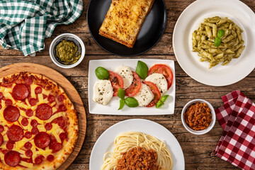 Wall Mural - Assortment of Italian pasta dishes on wooden table.Top view. 	