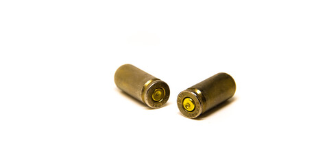 Two lying 9mm bullet sleeve on isolated background