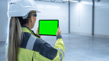 Poster - Industry 4.0 Modern Factory: Female Engineer Uses Digital Tablet Computer with Green Screen Mock-up Template Suitable for Visualizing Augmented Reality Software of Mapping Manufacturing Plant Room.