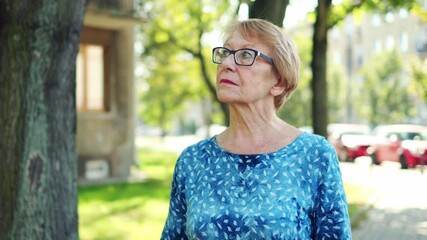 Wall Mural - Senior Woman Suffering From Chest Pain While Outdoors In The City
