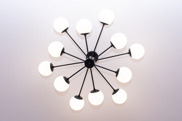 Indoor ceiling chandelier. Chandelier art of shape