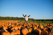 © Take A Pix Media/Stocksy - Asian Kid Jumping in Pumpkin Farm