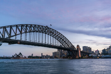 Fototapete - Sydney harbor bridge with Sydney CBD downtown skyline at sunset, Sydney, New South Wales, Australia