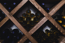Many Wine Bottles On Shleves In Wine Cellar